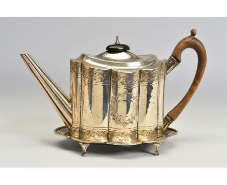 A GEORGE III SILVER TEAPOT AND STAND, of wavy oval form, bright cut engraved decoration, maker Charles Aldridge, London 1793,