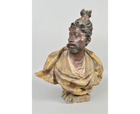 AN EARLY 20TH CENTURY COLD PAINTED TERRACOTTA GOLDSCHEIDER BUST OF A MALE TURK, his hair tied in a top knot and head turned t