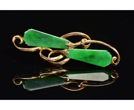 A JADE BROOCH, of horizontal organic design, set with two kite shape jade panels as abstract flower buds, stamped 14k, possib