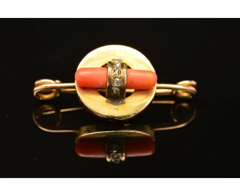AN ART DECO GOLD, CORAL AND DIAMOND BROOCH, designed as a central circular panel encasing a polished piece of elongated coral
