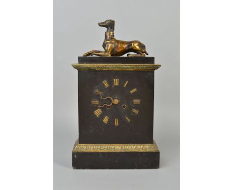 A LATE 19TH CENTURY BLACK SLATE AND GILT METAL MANTEL CLOCK, the rectangular top surmounted by a recumbant greyhound above a 