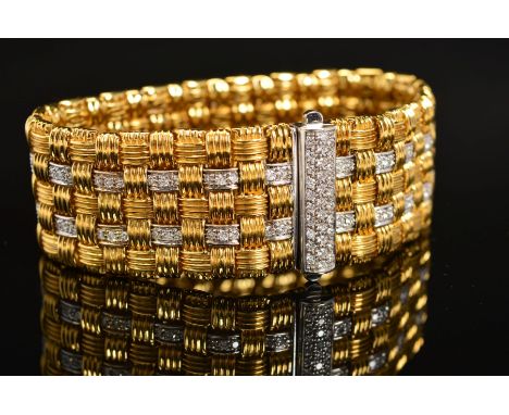 A MODERN 18CT GOLD ROBERTO COIN DIAMOND BRACELET, a wide flat panel link textured pattern with diamond links and a diamond se