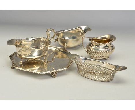 A PAIR OF GEORGE V SILVER OVAL SAUCE BOATS, wavy rims, 'S' scroll handles, on cabriole legs with hoof feet, makers Adie Broth