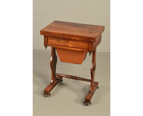 AN EARLY VICTORIAN ROSEWOOD GAMES AND WORK TABLE, the rectangular fold over swivel top with inlaid chess, cribbage and backga