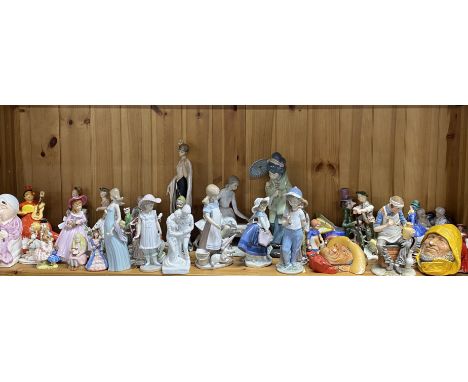 A group of porcelain and other figures including a number of Lladro, Nao, Royal Doulton etc.