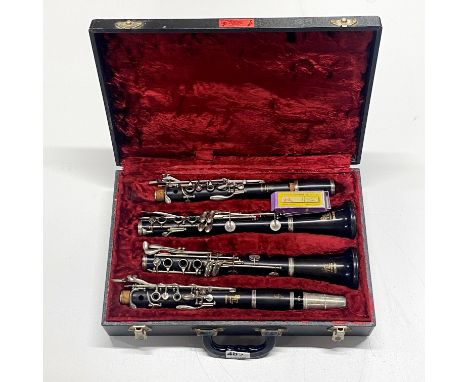 A cased Boosey &amp; Hawkes London, Edgware Bp clarinet with a box of antique clarinet reeds, each piece L. 35cm, 34cm, 35.5c