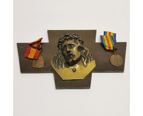 A bronze cross and medals (1960 US Marine, Vietnam). W.32cm H.16cm.