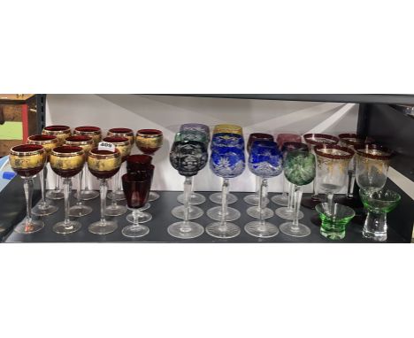 A set of ten gilt ruby hock glasses with a quantity of bohemian cut crystal etc.