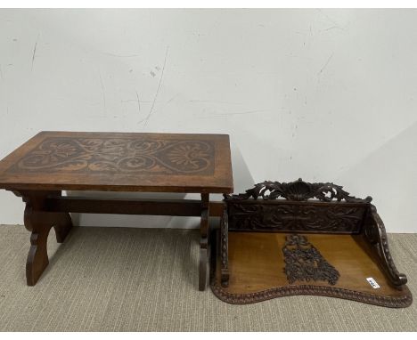 A Victorian carved mahogany wall shelf, width 59cm depth 25cm. Together with a poker work decorated low table.