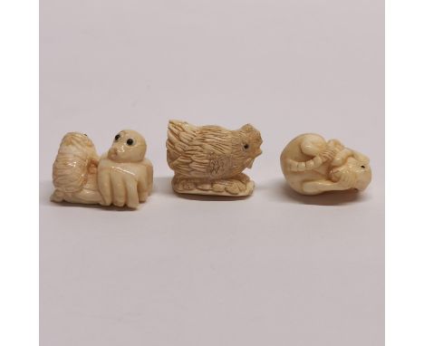 Three interesting signed carved bone netsuke, width 3cm.