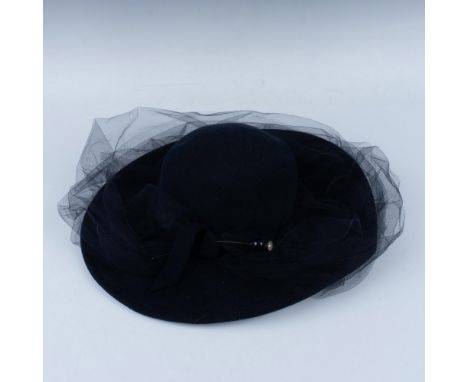 Simple elegance in the styling of the lace mantilla with matching hat pin. Adolfo II fabric tag. Issued: 20th centuryDimensio