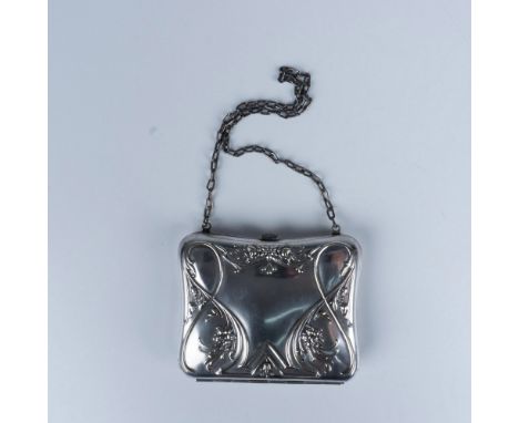 A delightfully small compact silver tone coin purse with a green interior and a small mirror. Issued: 20th centuryDimensions:
