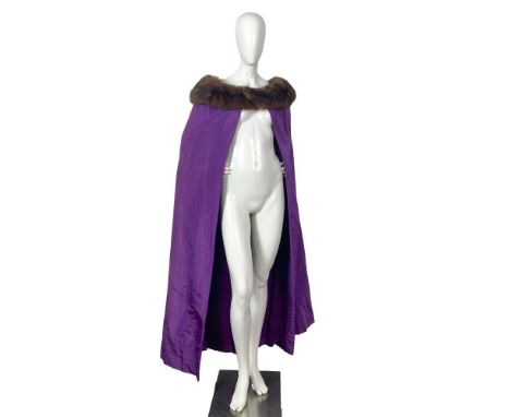 A stunning vintage bright purple cape with mink fur along the collar. Shoulder length: 20"W. Full length: 55"L. All measureme