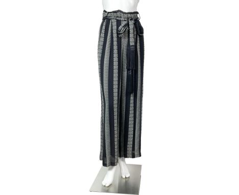 Original vintage Giuseppe Collection Bohemian chic chiffon wide leg black pants/skirt with tribal designs, an attached belt, 