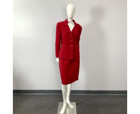 A vintage two-piece ensemble featuring a red jacket paired with a matching skirt. Size: 12. Bust: 18"W. Sleeve length: 22.75"