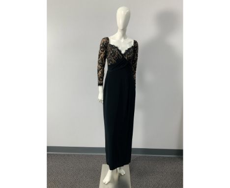 A vintage off the shoulder, sweet heart neckline, black and cream colored dress with a lace overlay at the top, embellished w