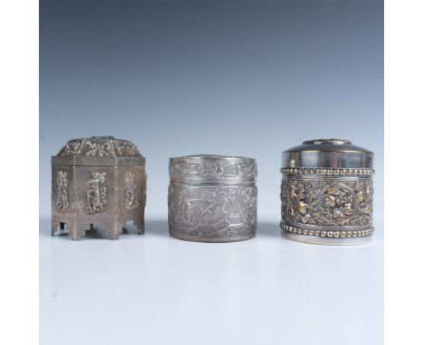 A captivating set of three metal trinket boxes, featuring a round box with gold accents adorned with a soldier on its lid and
