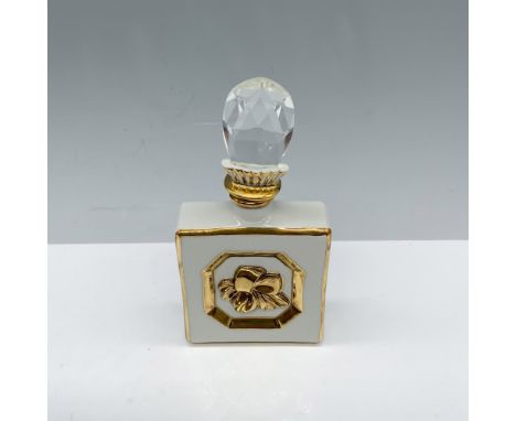 Darling square container used to store fragrance that has a gilt design around the borders as well as a bow design in the mid
