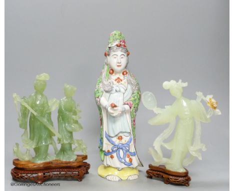   A pair of cased Chinese bowenite jade figure carvings and a porcelain figure of Guanyin, height 33cm