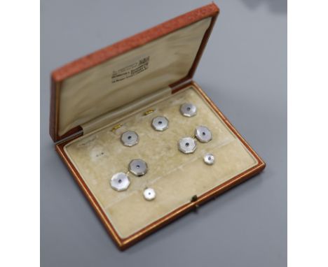   An early 20th century 18ct &amp; Pt, mother of pearl and sapphire set octagonal part dress stud set (one stud missing),diam