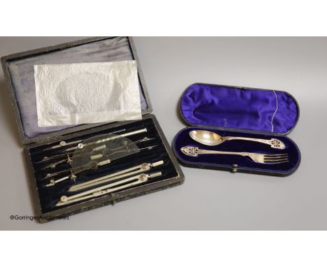   A cased Victorian silver christening spoon and fork, with pierced terminals, Jehoiada Alsop Rhodes, Sheffield, 1873 and a d