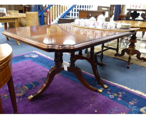   A Harrod's Regency style twin tri-pillar mahogany extending dining table, length 166cm, depth 108cm, height 72cm