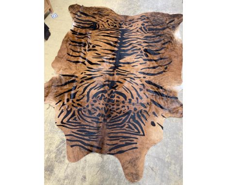   A tiger print South American cowhide rug, approx. 240 x 90cm