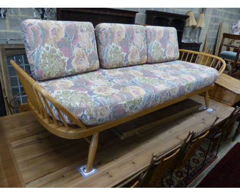   An Ercol light elm and beech settee 'surfboard' settee, length 206cm, depth 75cm, height 72cm