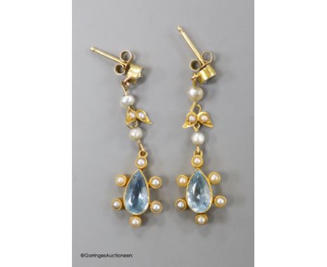   A pair of late Victorian 15ct, aquamarine and seed pearl set drop earrings, 33mm,gross weight 2.8 grams.