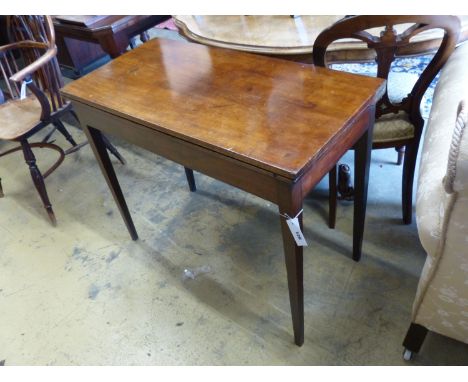   A George III rectangular mahogany folding card table, height 73cm, width 92cm, depth 45cm