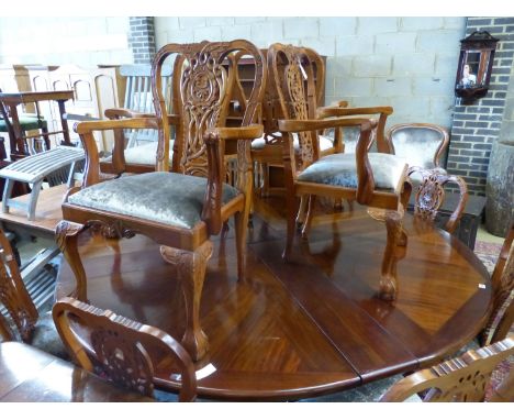   A set of twelve Chippendale style mahogany dining chairs, four with arms