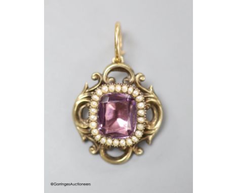   A late Victorian yellow metal foil backed? paste and seed pearl set pendant, 31mm, gross weight 8.5 grams.