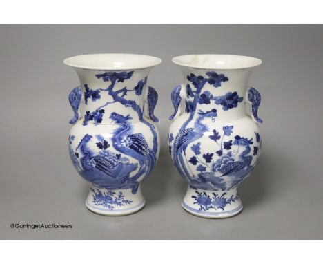   A pair of Chinese blue and white 'phoenix' vases, Kangxi marks but late 19th century, height 20cm (a.f.)