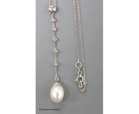   A modern white metal (stamped 14kt), cultured pearl and seven stone diamond chip set drop line pendant necklace, pendant 6c