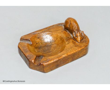   A Mouseman oak ashtray, width 10cm, slight loss to ear