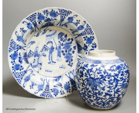   A Chinese blue and white dish, Kangxi mark and of the period, diameter 34cm, and a 19th century Chinese blue and white jar