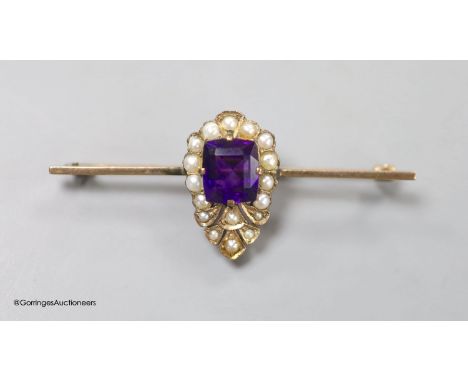   An Edwardian yellow metal, amethyst and split pearl set bar brooch, 54mm, gross weight 4.5 grams.