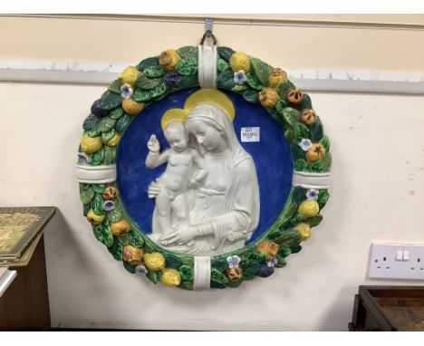   A Della Robbia type roundel, Madonna and Child