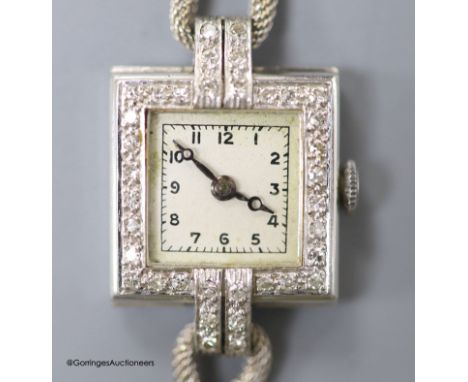   A lady's 1940's white metal (stamped platinum) and diamond set Vertex manual wind square dial cocktail watch, on a 9ct twin