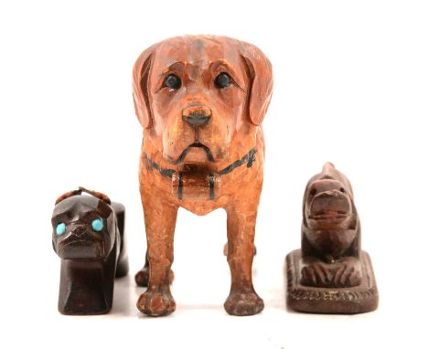 Three carved wood novelty dog models, one Black Forest style modelled as a standing Grand St Bernard, with colour staining, 9