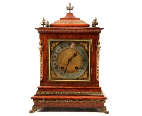 Oak bracket clock, the case with brass mounts, 15cm square brass dial, Lenzkirch movement striking on two gongs, height 42cm.