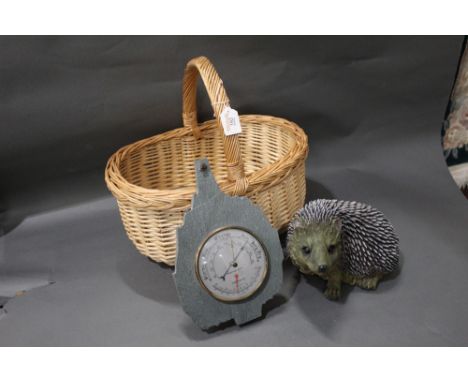 Basket, hedgehog ornament and barometer