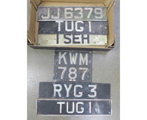 Six vintage metal and enamel car number plates; includes a pair, 'TUG1' and four others&nbsp;**PLEASE NOTE THIS LOT IS NOT EL