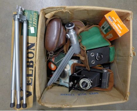 A collection of thirteen cameras and equipment including Kodak folding Brownie, Nomo, Cosmic135MS, plus tripods, flashgun and