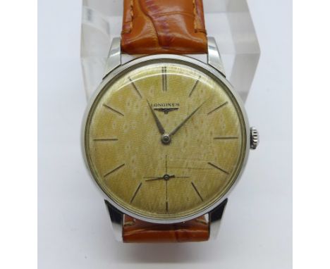 A Longines manual wind wristwatch with sub second dial, long service inscription to case back dated 1963 