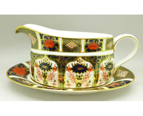 A Royal Crown Derby 1128 pattern gravy boat with stand 