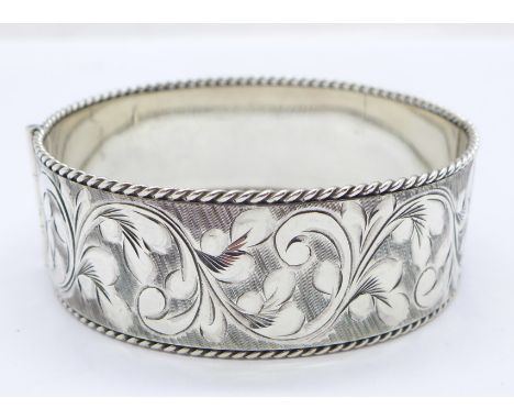 A silver bangle, 48g 