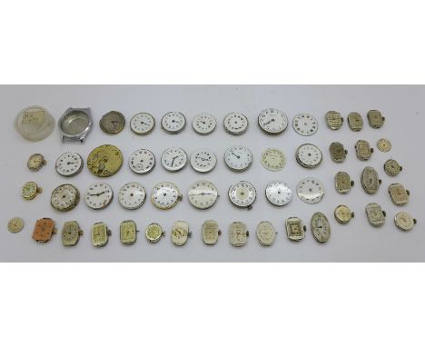 A collection of lady's wristwatch movements, etc., mainly with enamel dials 
