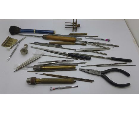 A collection of watchmakers tools 
