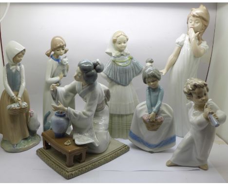 Two Lladro figures, a/f, three Nao figures, two a/f, and two others 